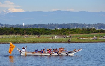 The Salmon Dancer Canoe Family paddles along the shorelines of Swinomish. Ann Smock