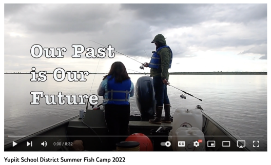 A screenshot of a Youtube Video that depicts two people standing on the back of a fishing boat with a river in the background and an overlaid title: Our Past is Our Future