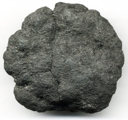 A course, bumpy, and slightly fissured grayish-black rock known as a polymetallic nodule