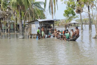 Bangladeshi community navigating floodwaters