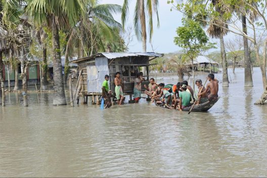 Bangladeshi community navigating floodwaters